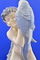 Royal 
Copenhagen 
Figur. 
Porzellanfigur, 
sitzender Faun 
mit Papagei Nr. 
752. Höhe 18 
cm. ...