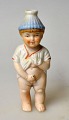 Bisquit-Figur – 
kaltbemalt, 
Deutschland des 
19. 
Jahrhunderts. 
Ein kleiner 
pinkelnder 
Junge. H: ...