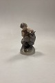 Royal Copenhagen Figurine Faun with Owl No. 2107. Designed by Chr. Thomsen in 1920. Measures ...