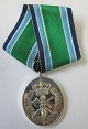 Silbermedaille 
für 25 Jahre 
freiwilligen 
Dienst in der 
Heimwehr. 
Dänemark. Mit 
dem Band. H:. 
8,5 cm.