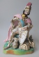 Italienische 
Porzellanfigur 
mit Sitzender 
Prinz, 19. 
Jahrhundert. 
Polychrom 
dekoriert mit 
...