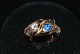 Snake Ring with 
Diamond and 
Sapphire, 14 
Karat Gold
Stamp: 585
Size: 56 / 
17.82 ...