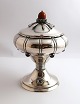 Danish work. Silver bonbonniere on foot with 6 amethysts and amber ball (830). 
Height 19 cm. Produced 1919.