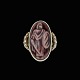 Jais Nielsen 
1885-1961. Ring 
i forgyldt 
sterling sølv 
med keramisk 
relief. 
Tegnet af Jais 
...