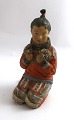 Royal 
Copenhagen. 
Figur eines 
grönländischen 
Mädchens. 
Modell 12415. 
Höhe 14,5 cm. 
(1 Wahl)