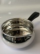 Cocotte, bowl 
with handle in 
sterling silver
Stamp: 
Sterling 925s 
Denmark
Designed by F. 
...