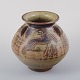 Jais Nielsen 
for Royal 
Copenhagen.
Ceramic vase 
in sung glaze 
with religious 
motifs.
Model: ...
