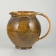 Svend 
Hammershøi 
(1873–1948) for 
Kähler
Jug in glazed 
ceramic with 
beautiful 
uranium ...