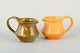 Kähler pitchers 
with uranium 
glaze.
Two ceramic 
pitchers from 
Kähler, glazed 
in green and 
...
