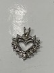 Beautiful 
pendant, shaped 
like a Heart 
with inlaid 
Diamonds, in 14 
carat white 
gold. Suitable 
...