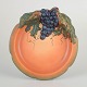 Ipsens Enke
Decorative 
wall dish with 
grape motif, 
ca. 1920s/30s.
Round glazed 
ceramic plate 
...