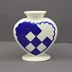 Royal 
Copenhagen blue 
christmas heart 
in faience. 
With space for 
a candle and 
two branches. 
H. ...