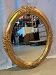 Guldmalet spejl fra 2000erne.Det har brugsspor.Højde 61cm Bredde 51cm