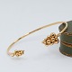 Georg Jensen; A Moonlight Grapes bangle in 18k gold, set ...