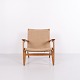 CH25 Sessel von Hans J. Wegner aus patinierter massiver Eiche mit geflochtener Sitzfläche und ...